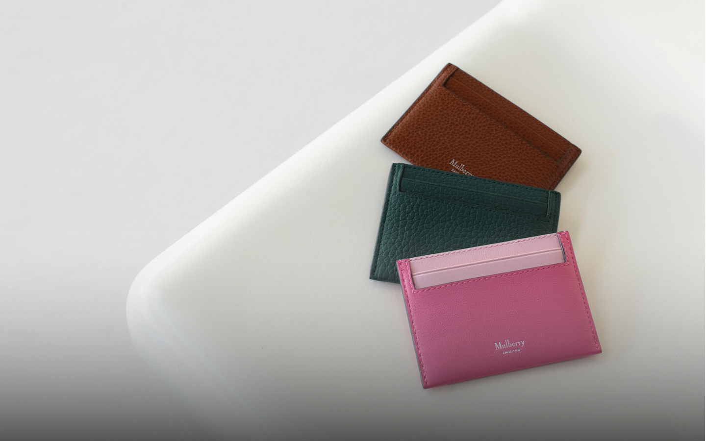 mulberry credit card slips in pink, green and oak